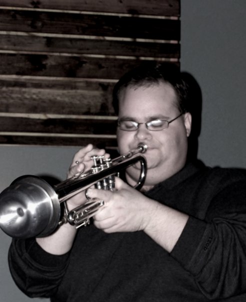 Picture of Lance playing a trumpet